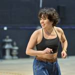 393375 Ami Okumura Jones in rehearsals for My Neighbour Totoro © Manuel Harlan Ami Okumura Jones wearing a black top and jeans looking to the left with her arms in front of her.