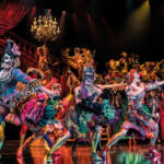 Ensemble Jumps in full masquerade costume