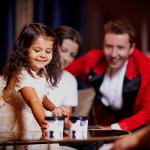 A child reaching for ice cream as part of one of our hospitality experiences